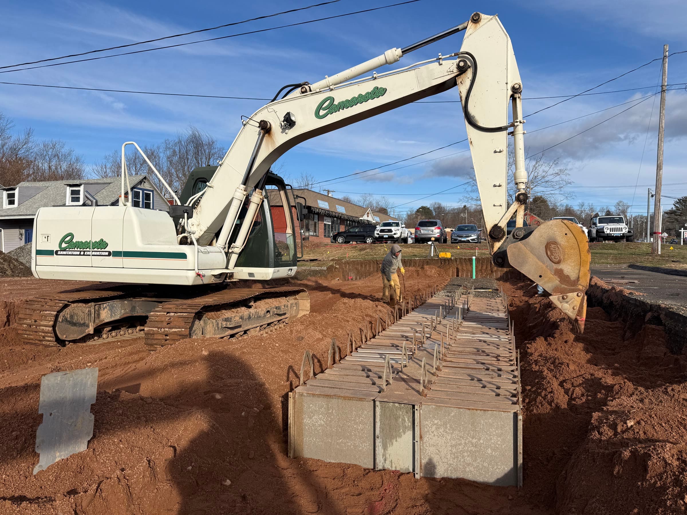GST leaching system installation on a Connecticut Shoreline lot, with a Camarota excavator beside the new system.